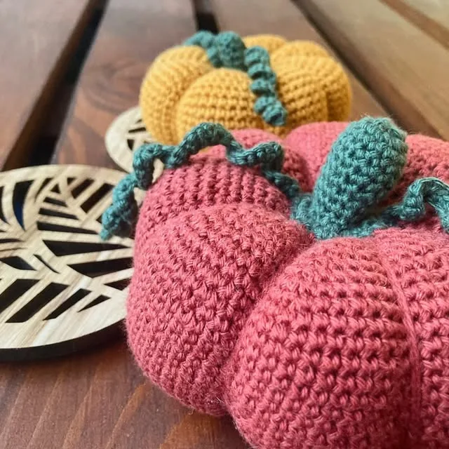Crocheted pink and yellow pumpkins